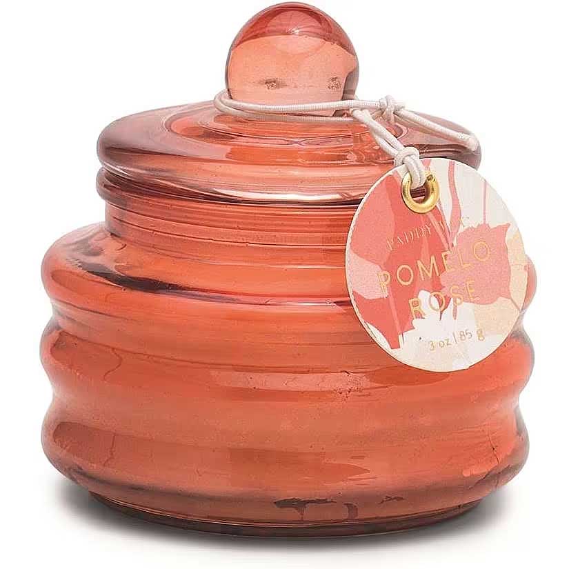 CANDELA IN CONTENITORE IN VETRO ROSSO PROFUMO POMELO E ROSA